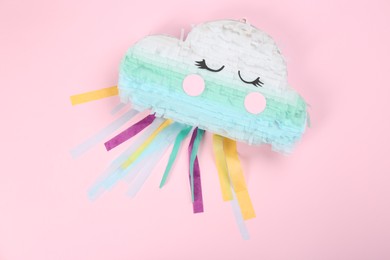 Photo of Bright cloud pinata on pink background, top view