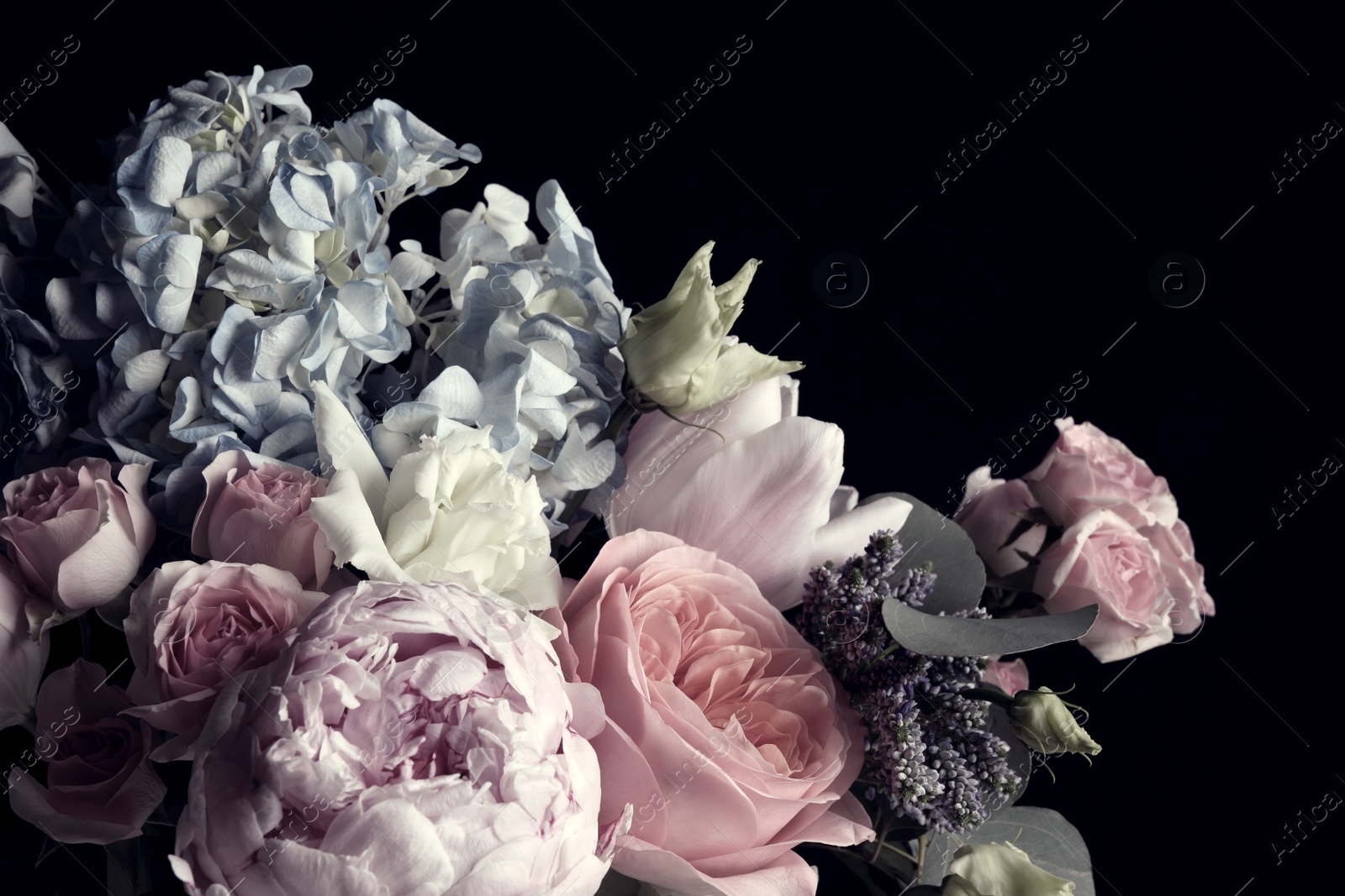 Photo of Beautiful bouquet of different flowers on black background. Floral card design with dark vintage effect