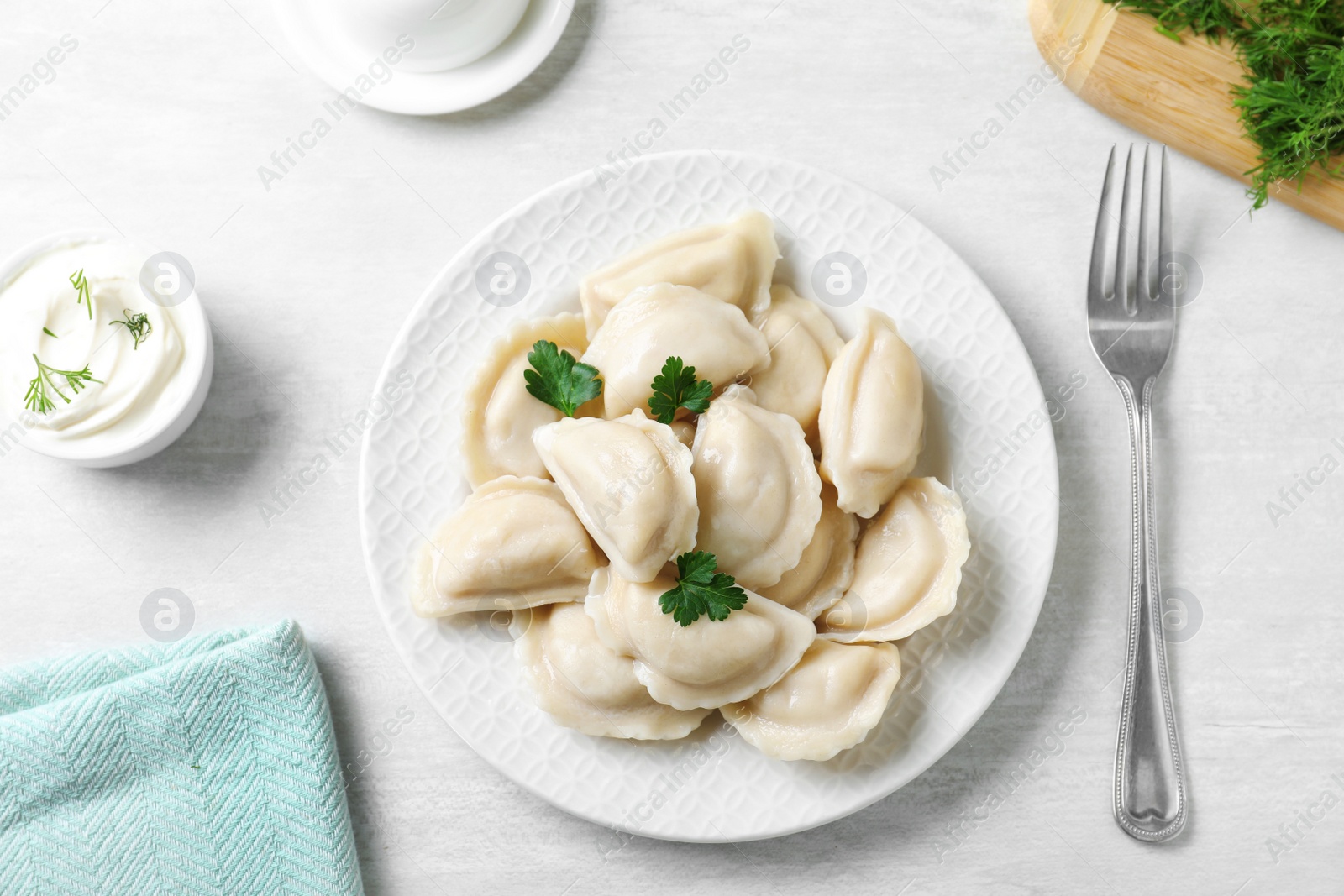 Photo of Flat lay composition with tasty dumplings served on white table