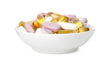 Different vitamin pills in bowl isolated on white. Health supplement