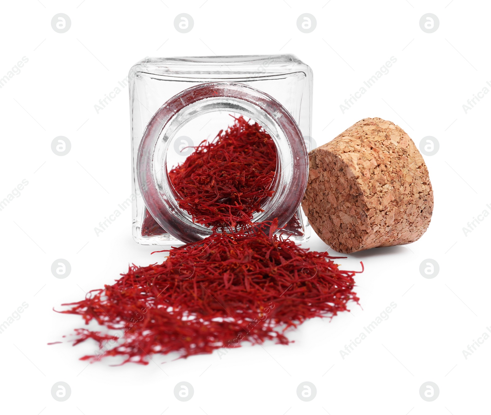 Photo of Aromatic saffron and glass jar isolated on white