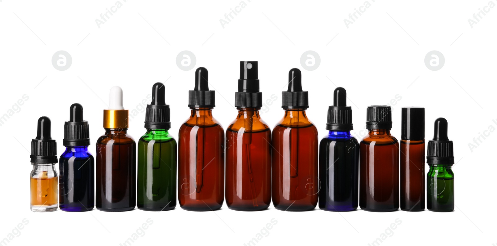 Photo of Cosmetic bottles of essential oils on white background