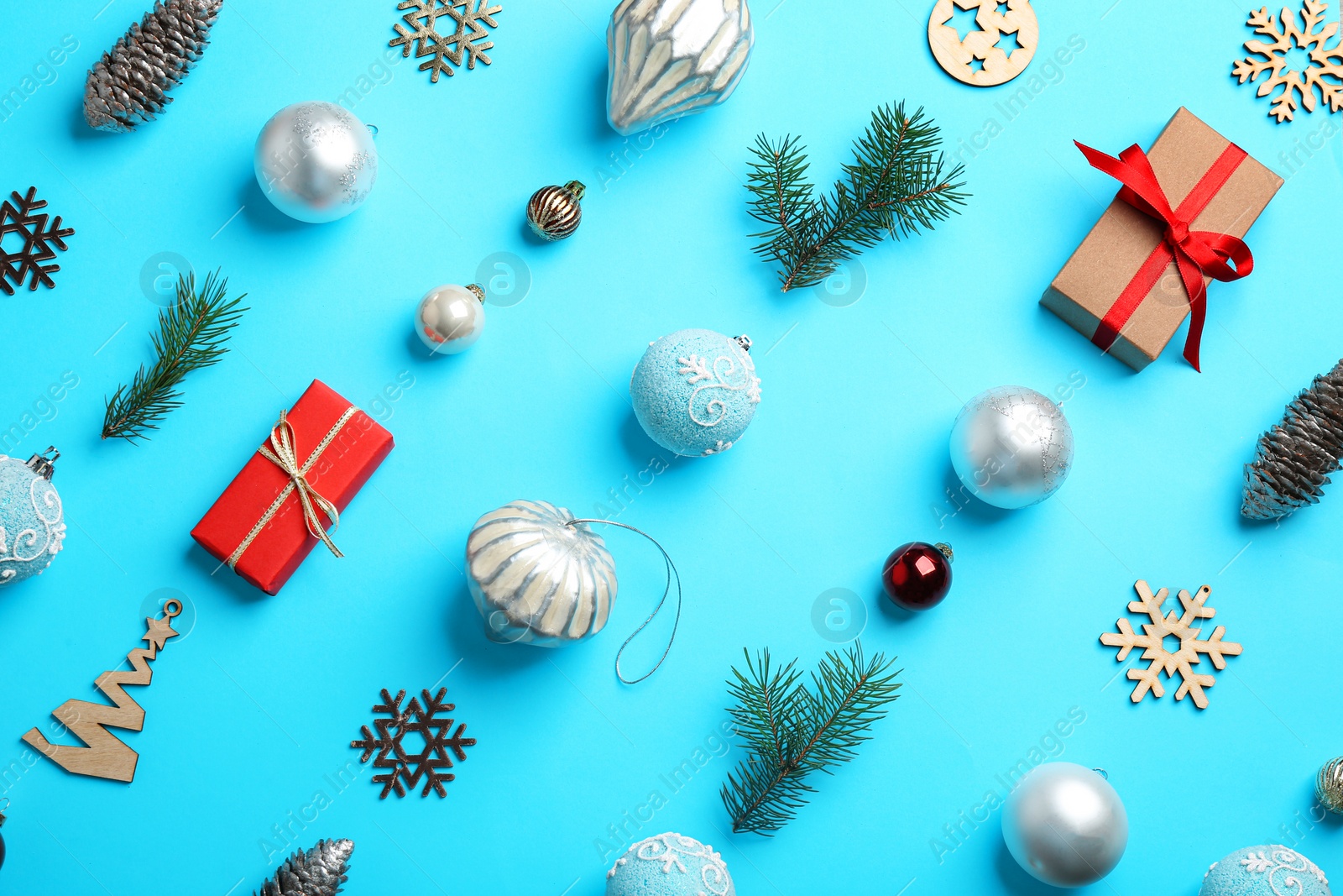 Photo of Flat lay composition with Christmas decor on light blue background