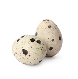 Photo of Beautiful speckled quail eggs on white background