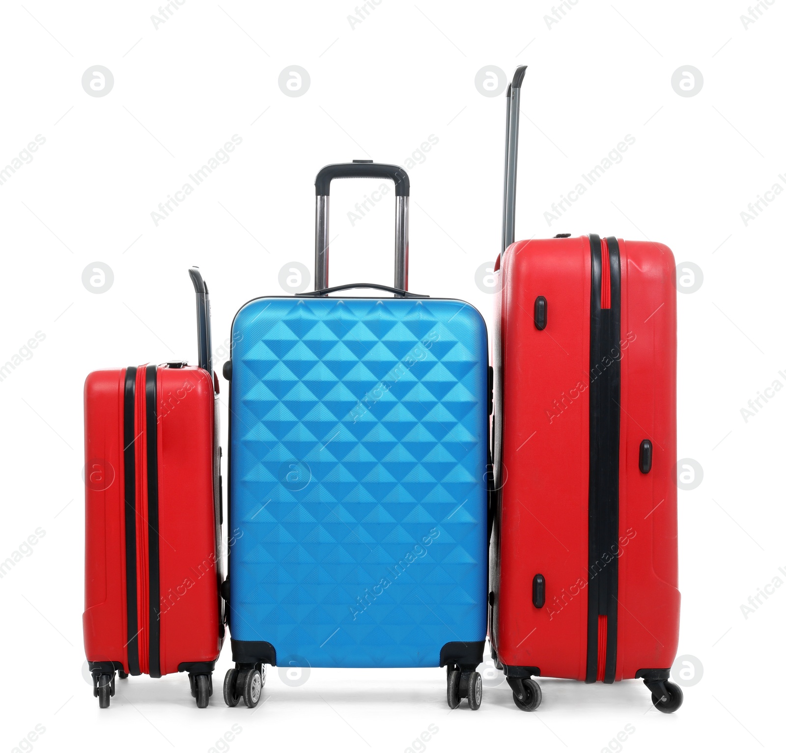 Photo of New suitcases packed for journey on white background