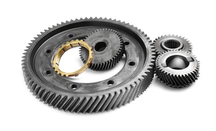 Photo of Different stainless steel gears on white background