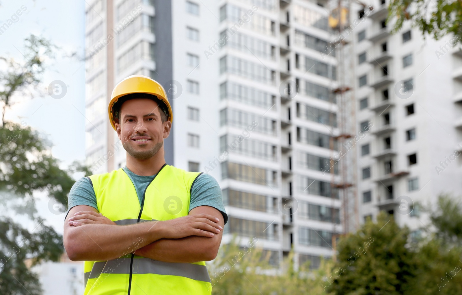 Photo of Professional engineer in safety equipment at construction site