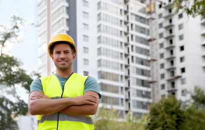 Professional engineer in safety equipment at construction site