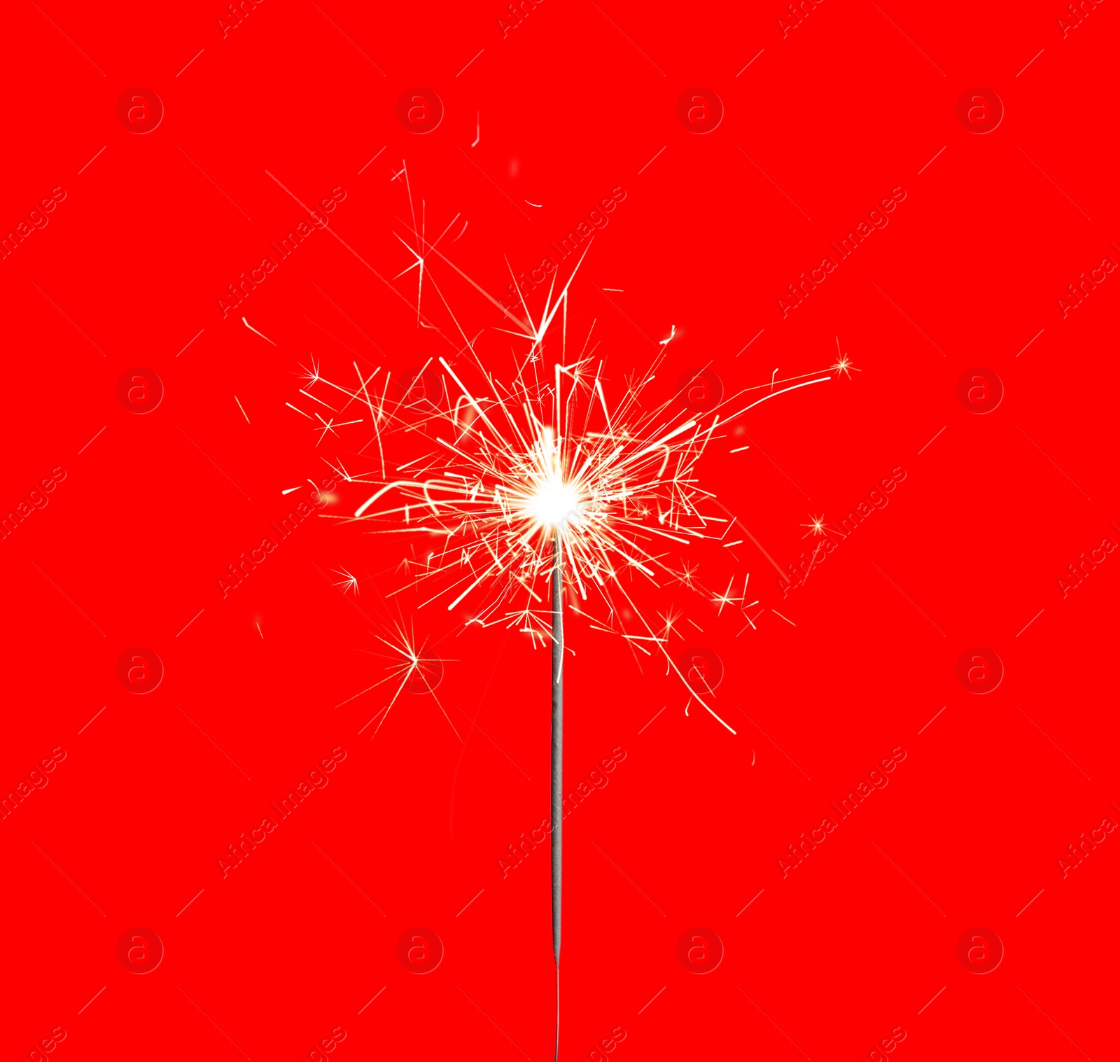 Image of Beautiful sparkler burning on red background. Party decor