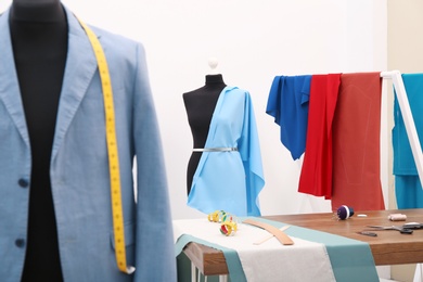 Mannequin with blue cloth in tailor studio