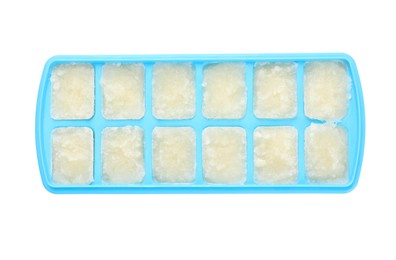 Photo of Cauliflower puree in ice cube tray isolated on white, top view