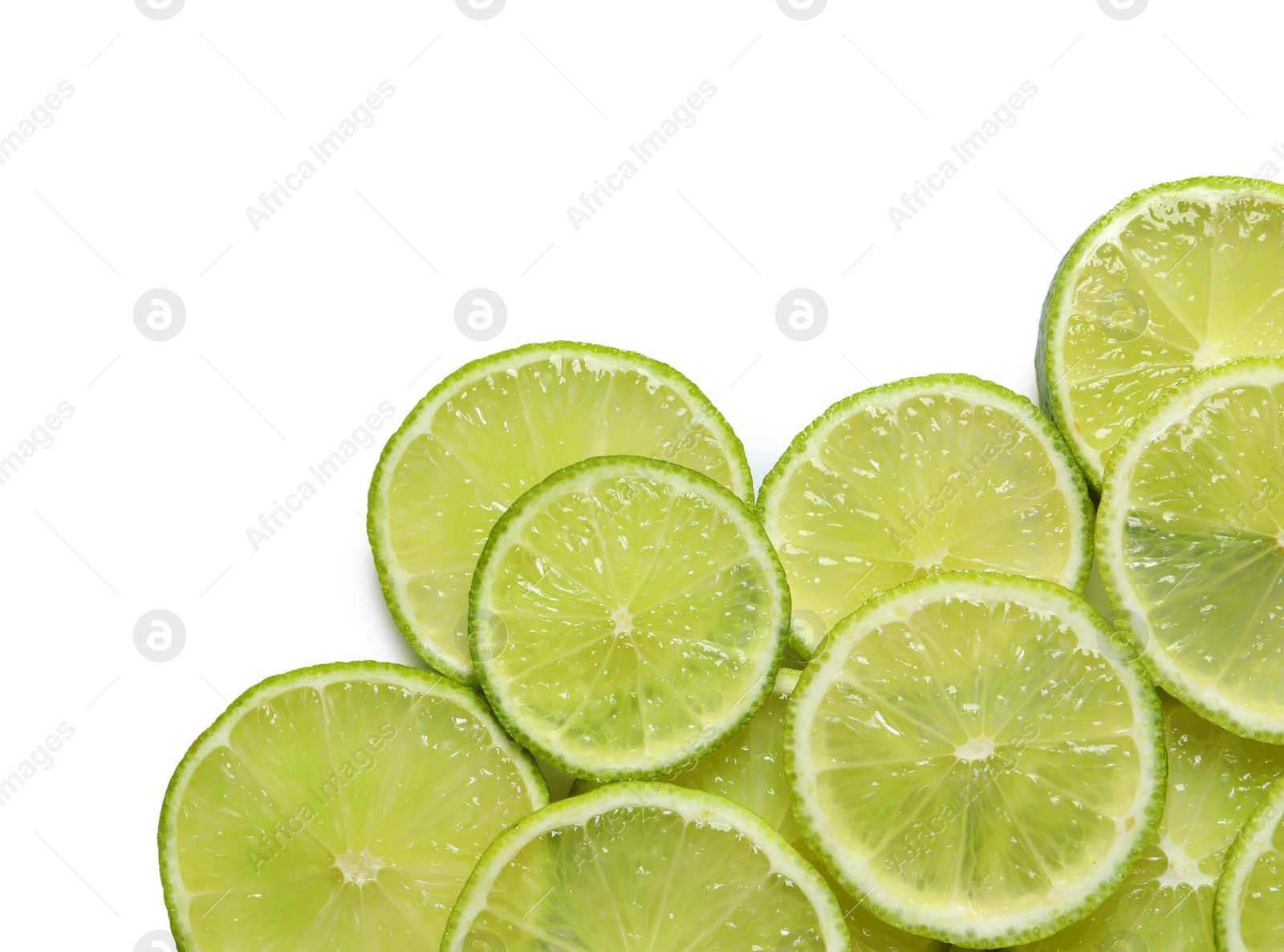 Photo of Juicy lime slices on white background, top view. Citrus fruit