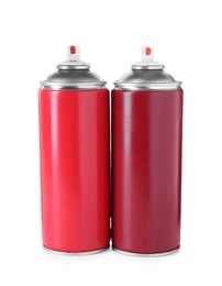 Photo of Cans of spray paints isolated on white