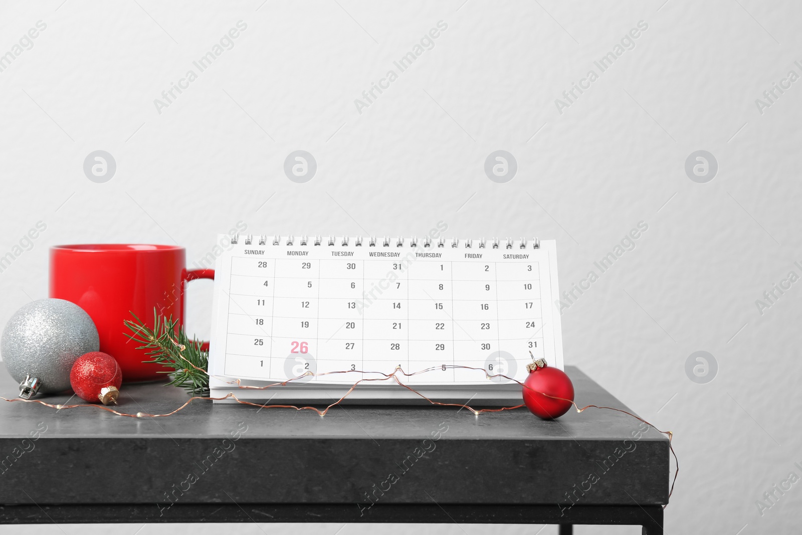 Photo of Calendar and festive decor on table. Christmas countdown