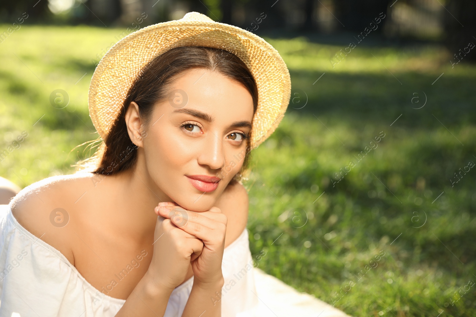 Photo of Beautiful young woman in park on sunny day