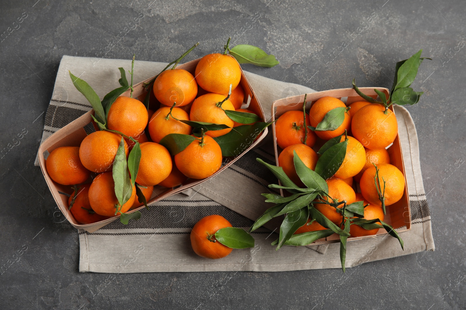 Photo of Flat lay composition with fresh ripe tangerines on grey background