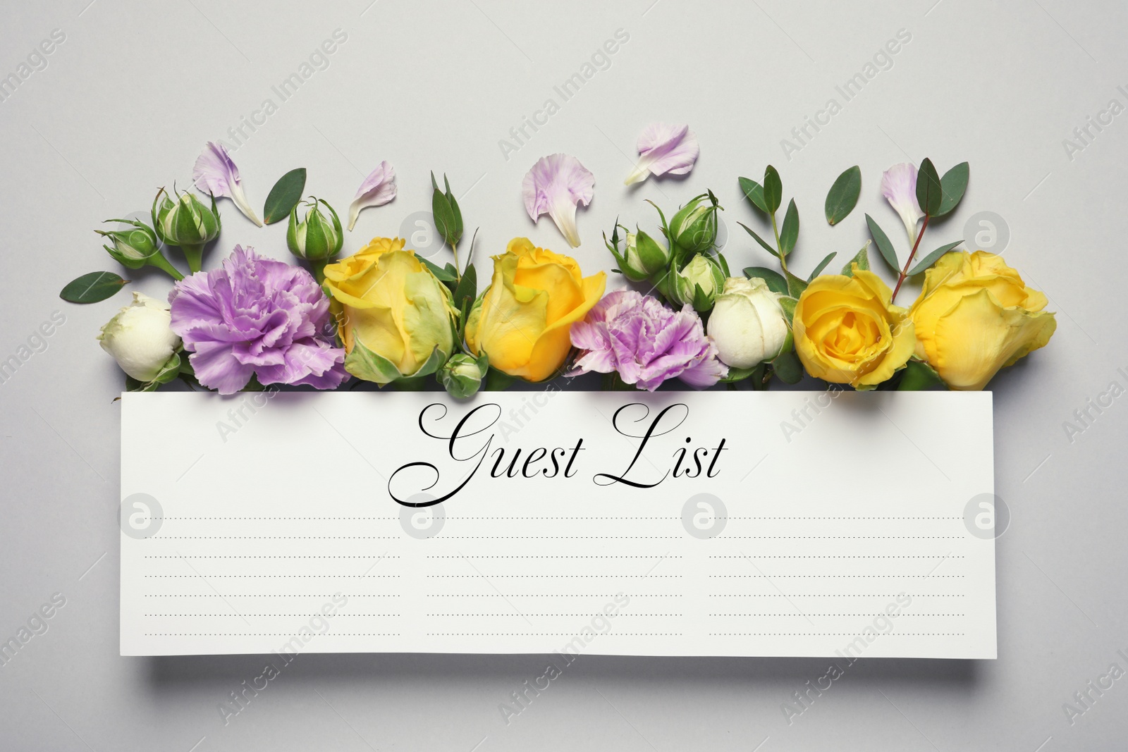 Image of Guest list and beautiful flowers on light grey background, flat lay