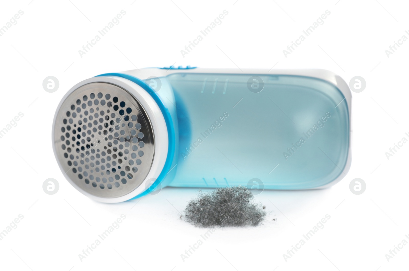 Photo of Modern fabric shaver and lint on white background