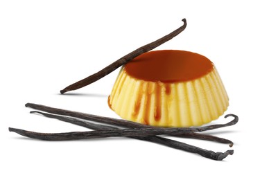 Delicious caramel pudding and vanilla pods isolated on white