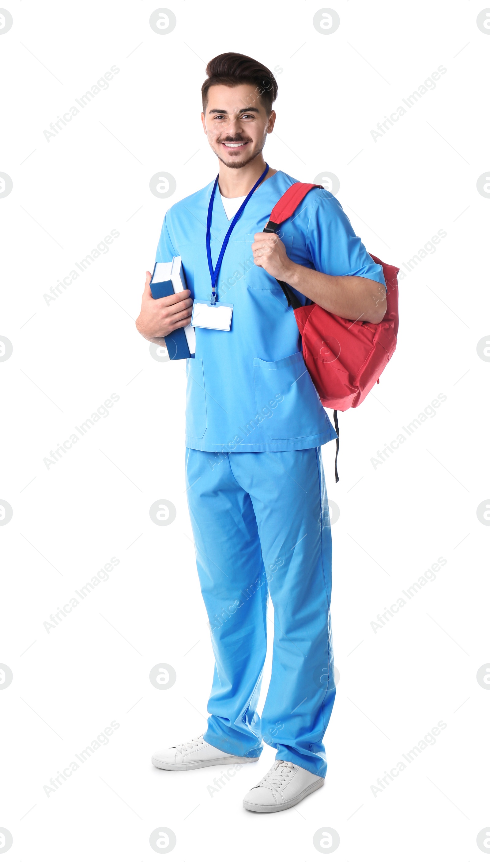 Photo of Young medical student with books and backpack on white background