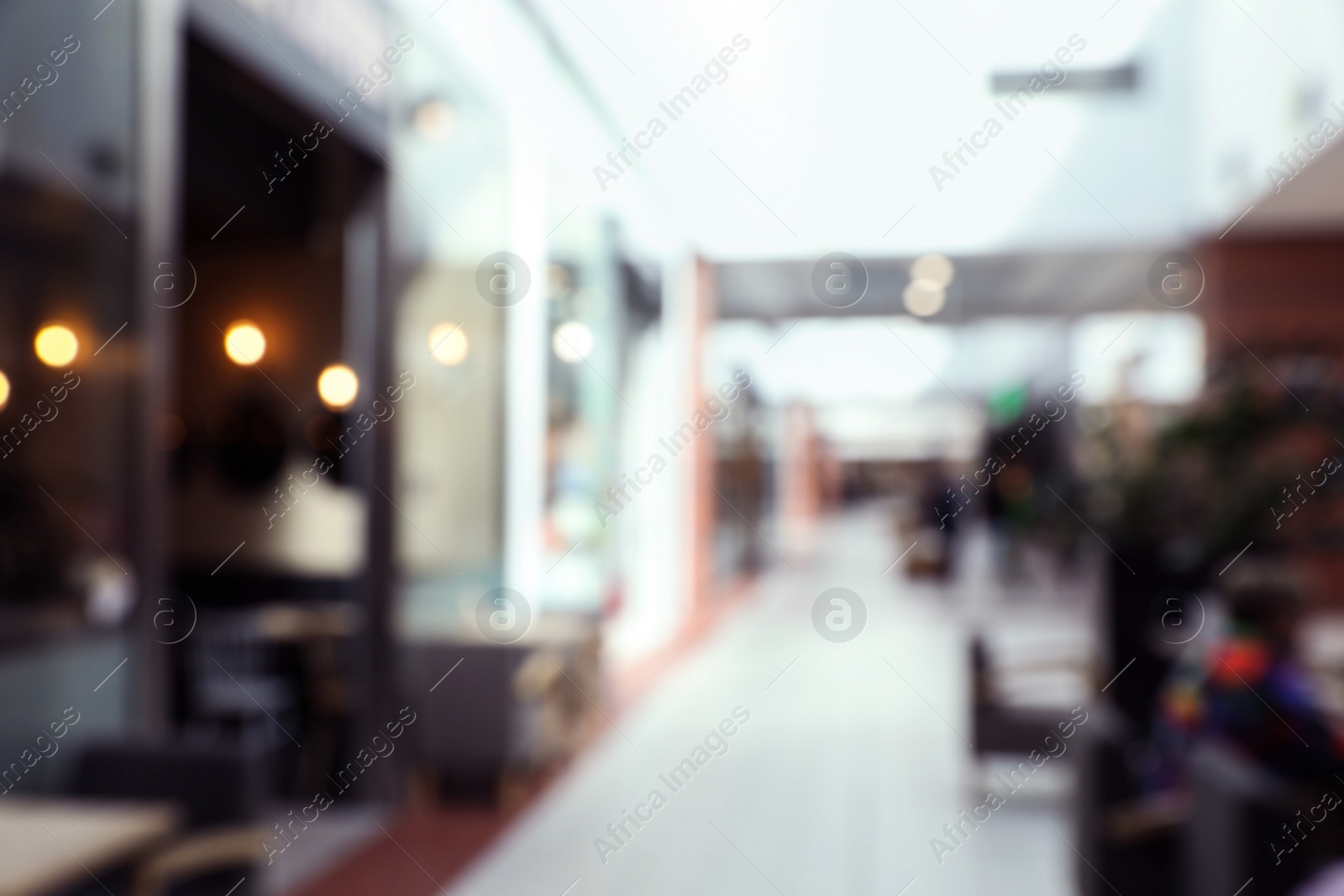 Photo of Blurred view of shopping mall interior. Bokeh effect