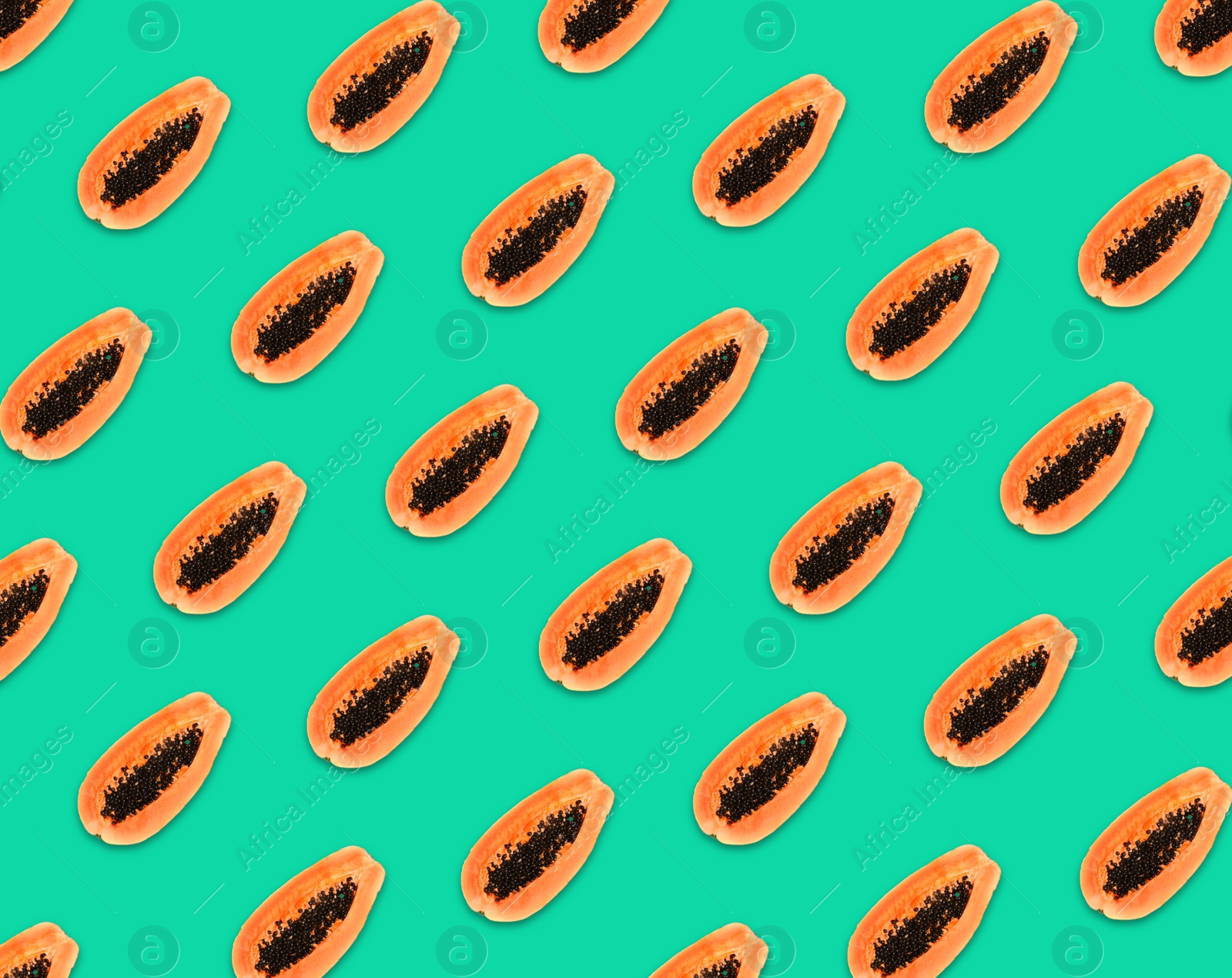 Image of Pattern of papaya halves on turquoise background