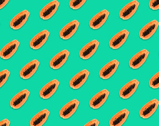Image of Pattern of papaya halves on turquoise background