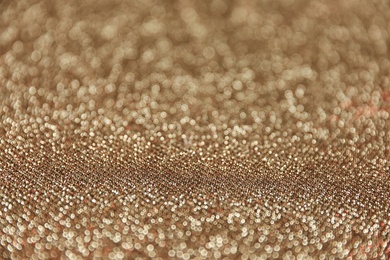 Gold glitter with bokeh effect as background, closeup