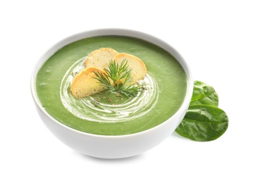 Photo of Fresh vegetable detox soup made of spinach with croutons in dish and leaves on white background