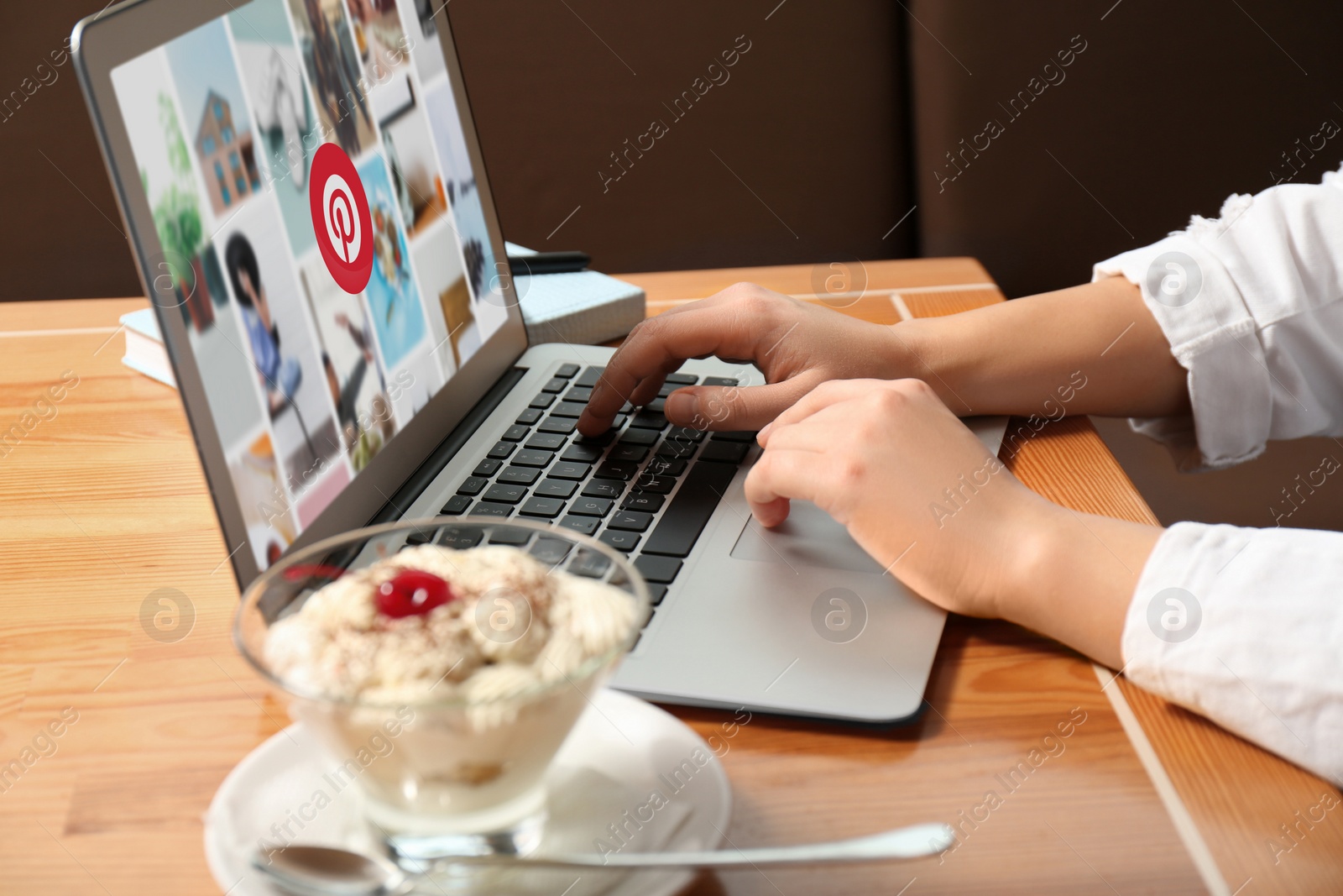 Image of MYKOLAIV, UKRAINE - MAY 4, 2020: Woman using Pinterest site on laptop indoors, closeup. Social media web