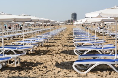 Many beach umbrellas and sunbeds on resort