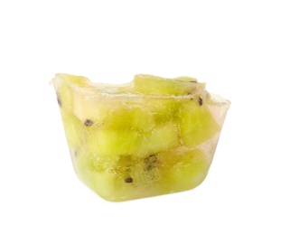 Ice cube with cut kiwi on white background