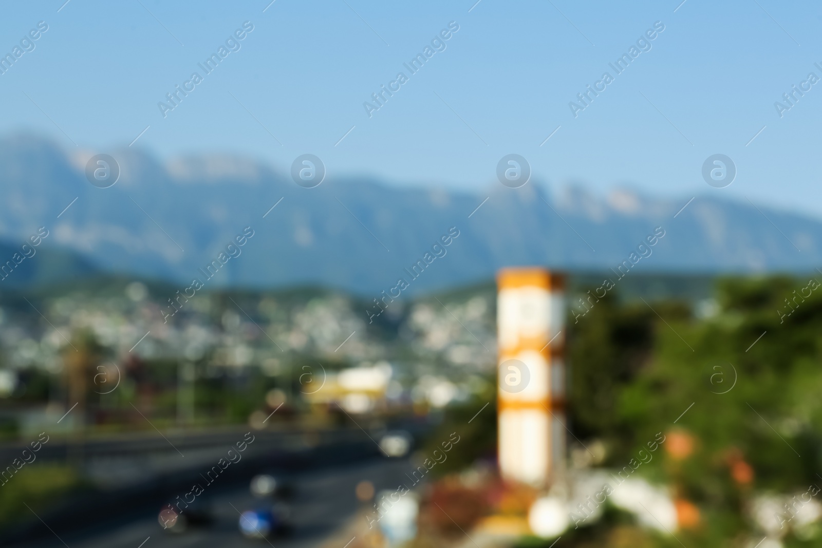 Photo of Blurred view of mountains and highway with cars