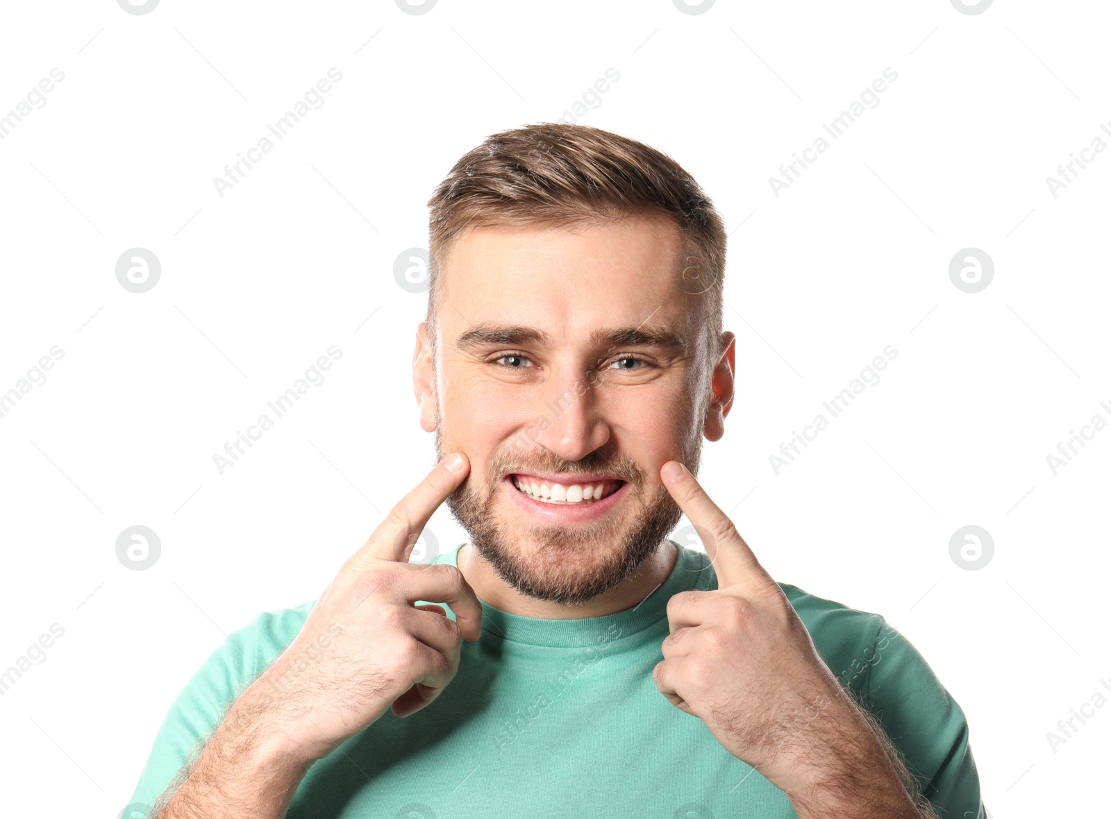 Photo of Young man with healthy teeth on white background