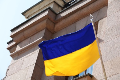 Flags of Ukraine and Mykolaiv on building facade