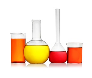 Laboratory glassware with colorful liquids on white background