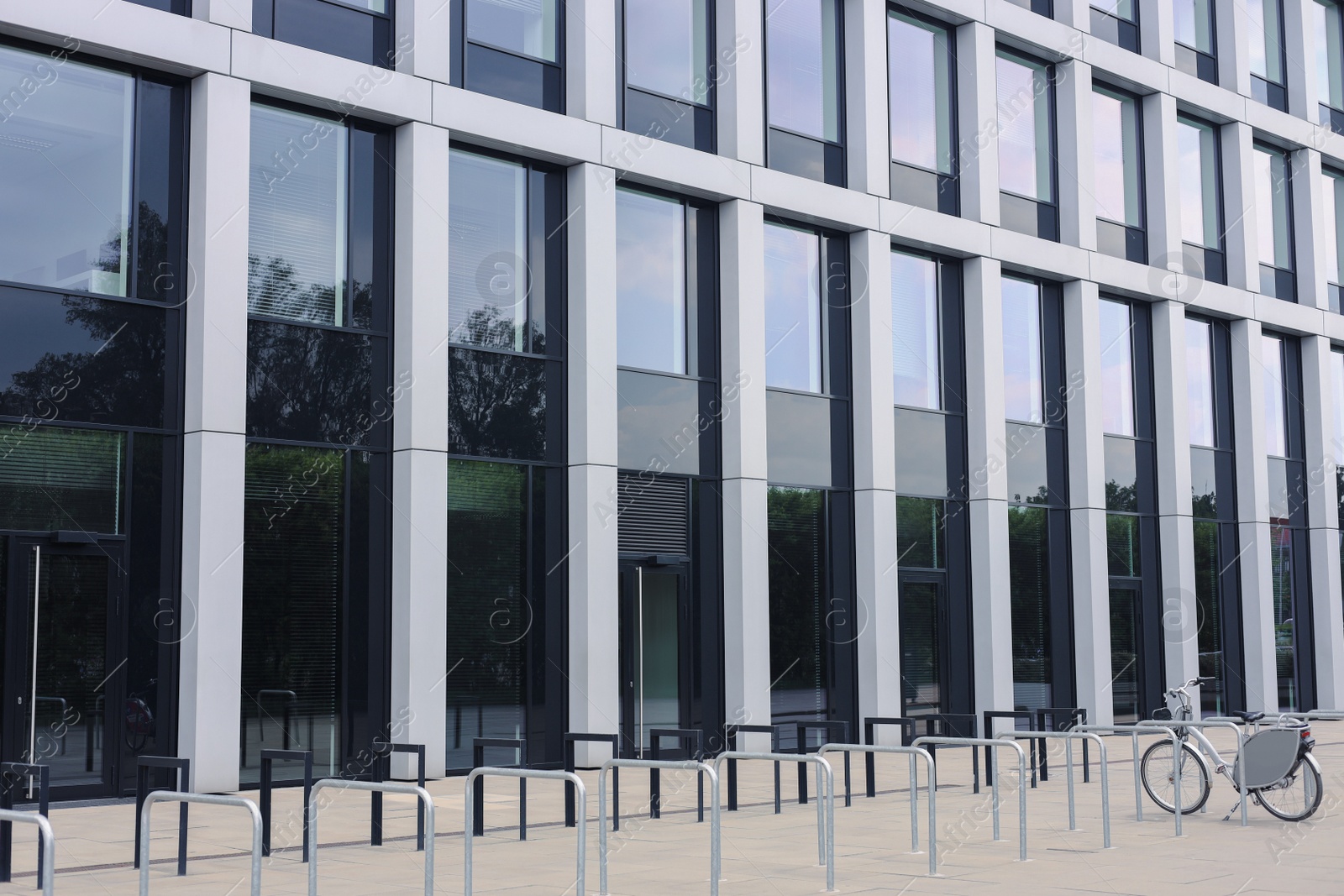 Photo of Beautiful view of bicycle stands near modern building