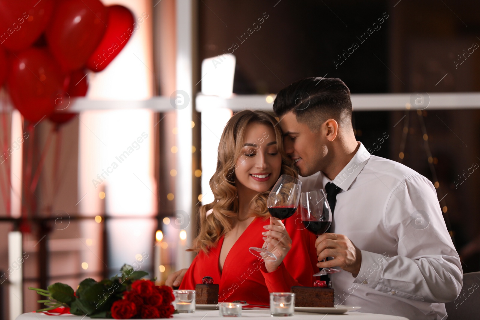 Photo of Lovely couple having romantic dinner on Valentine's day in restaurant