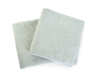 Soft folded towels isolated on white, top view