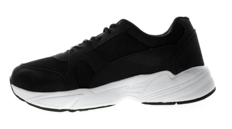 Photo of New black sports sneaker isolated on white