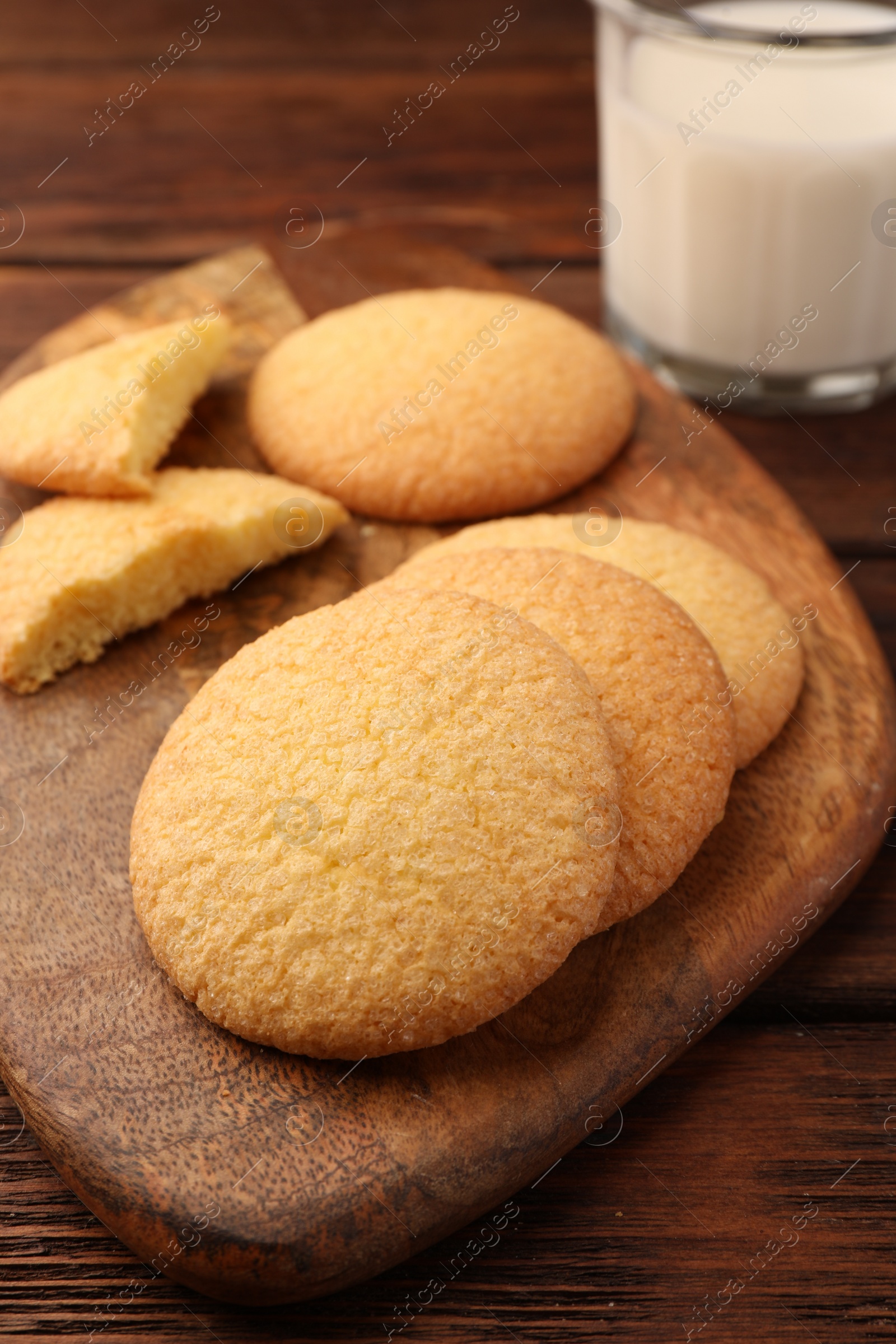 Photo of Delicious Danish butter cookies on wooden table, closeup