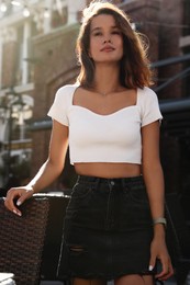 Portrait of beautiful young woman outdoors on sunny day