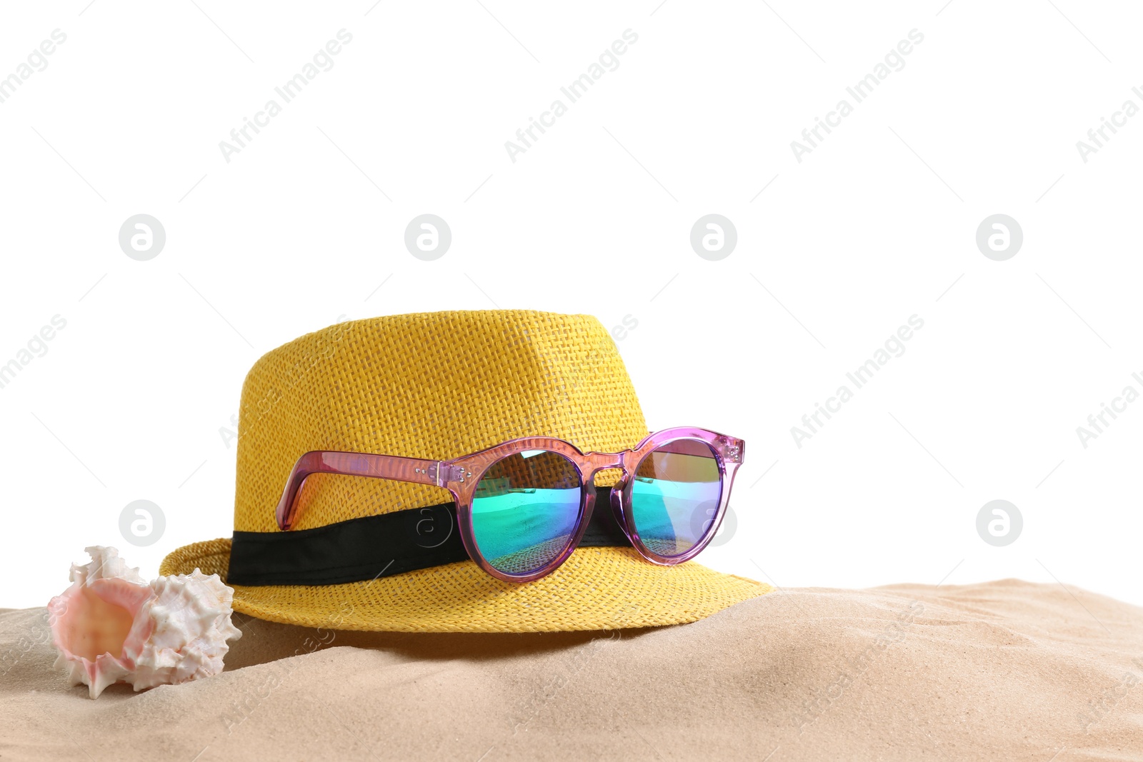 Photo of Composition with hat, beach sand and sunglasses on white background, space for text