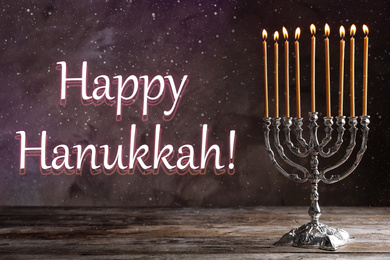 Image of Silver menorah on wooden table. Happy Hanukkah!