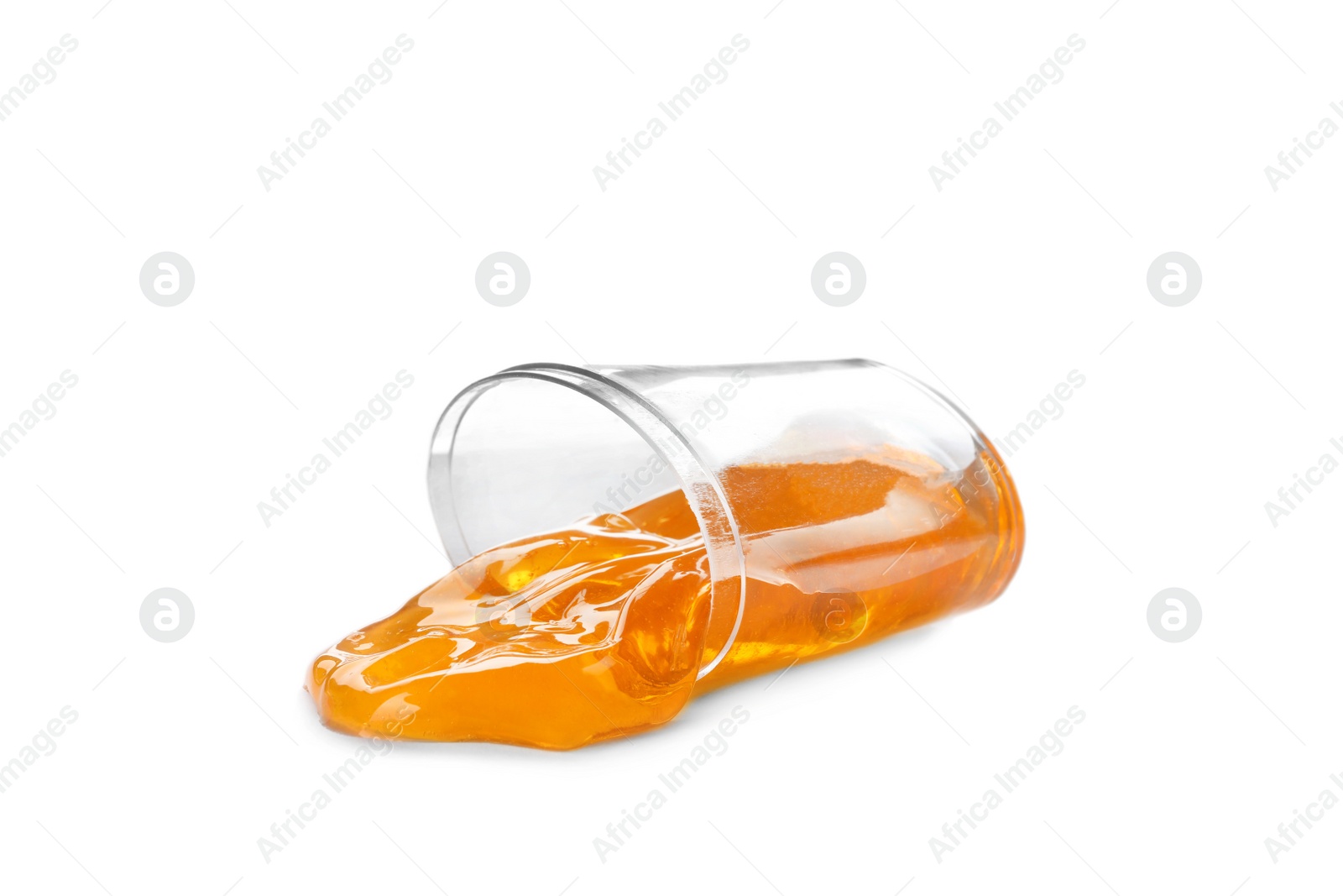 Photo of Overturned plastic container with orange slime isolated on white. Antistress toy