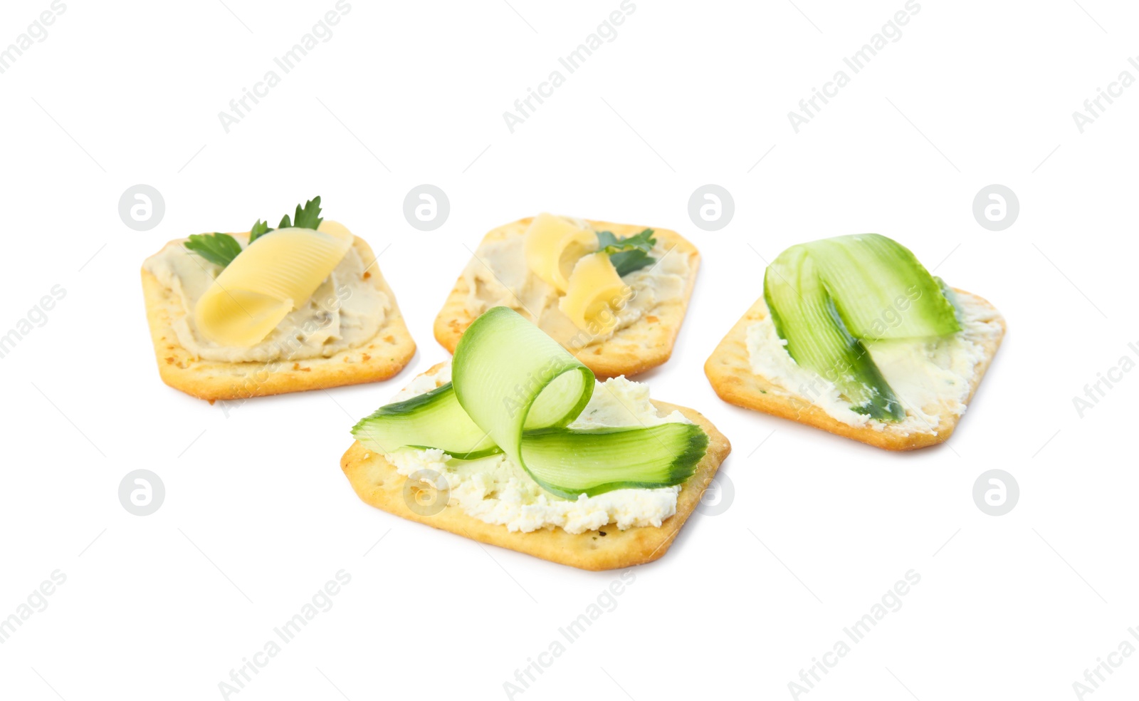 Photo of Delicious crackers with humus and cheese on white background