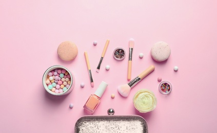 Photo of Makeup products with cosmetic bag on color background