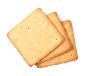 Photo of Three crispy crackers isolated on white, top view. Delicious snack