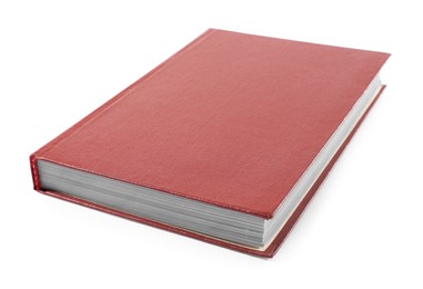 Photo of One closed red hardcover book isolated on white