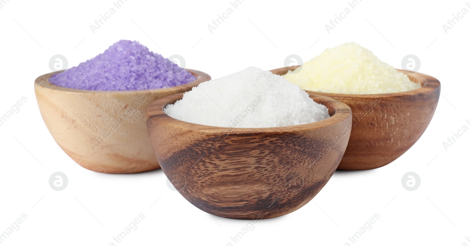 Photo of Wooden bowls with different sea salt on white background